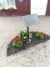 Flowers planted to honor late police chief