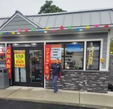 Business owner Nikki Kaur outside the new Gulf station in Goshen.