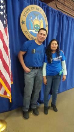 Jonathan Jimenez and Berta Ramos, Mexican immigrants living in Goshen, attended CVH (Community Voices Heard) rally at the Newburg Armory Unity Center (Photo by Frances Ruth Harris)