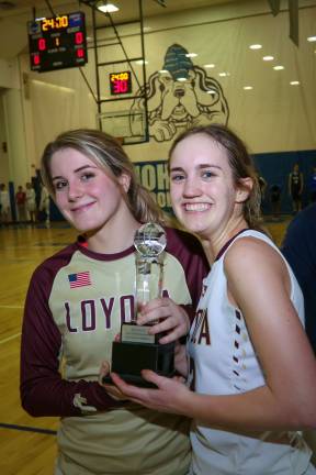 Co-captains Summer O&#x2019;Sullivan and Tori-May Della Pace (right) of Loyola School celebrate their NYCAL championship victory over Columbia Prep last month. Photo: Mark Wyville