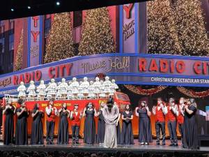 Students performing on stage at Radio City Music Hall.