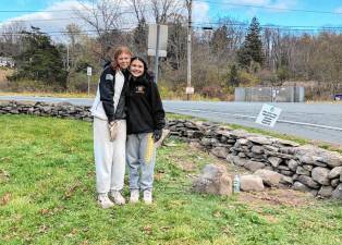 Arianna Weinberg helped fix a park wall.