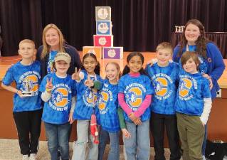 The CES Odyssey of the Mind team celebrates their achievement.