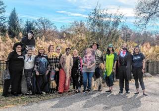 Last week, the staff at the Goshen Public Library and Historical Society gatehred outside for a group photo in their Halloween constumes.