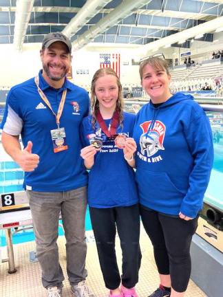 Coach Dr. Gregory Voloshin, Kaylee Croughan, and Coach Janet Albanese at the NYSPHAA swimming and diving championship.