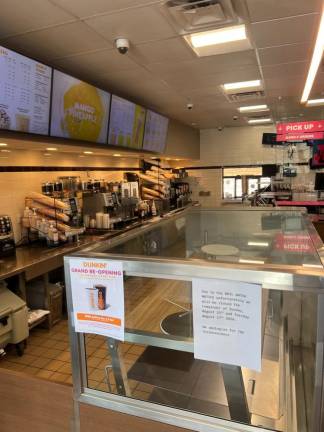 A sign posted in the Goshen Dunkin’ Donuts said it was closed Tuesday due to the boil water advisory.