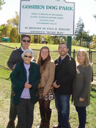 Goshen Dog Park creator Kelly Fellenzer (center) is flanked by Phyla Wright, wife of the park's namesake, Paul E. Wright, on her right and the Village of Goshen Mayor Kyle Roddey and Julie Turi, daughter of Paul and Phyla Wright on her left. Kevin Armistead, chair of the Goshen Parks and Recreation Commission, is in the back. (Photo by Geri Corey)