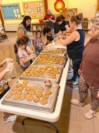 The scouts baked dozens of cookies to give out to the veterans at Monday’s ceremony.