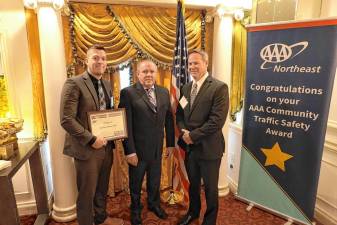 On Oct. 8, Goshen Village Police Sgt. David Yates and Det. Michael Feo accept a Bronze Award from the AAA Community Traffic Safety Awards Program for participating in projects such as pedestrian, motorcycle, bicycle, and child passenger safety initiatives.