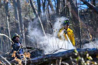 Firefighters work to battle the Jennings Creek Fire.