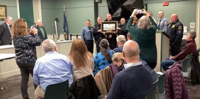 The Warwick Police Department presents the Goshen Police Department with a plaque for aiding the town.