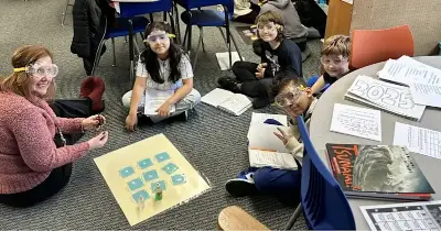 Chester Elementary students in Rebecca Quackenbush’s class experiment with chemicals.