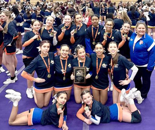 S.S. Seward’s varsity cheer team celebrates their win.