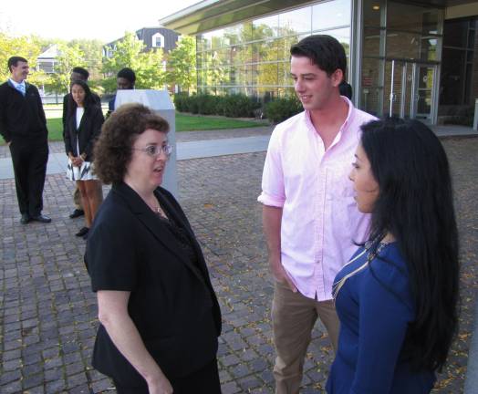 Robin Rosenberg, coordinator of co-ops and internships at the Mount&#x2019;s Career Center, speaks with students Patrick Kennedy and Stephanie Molina outside the courthouse in Goshen.