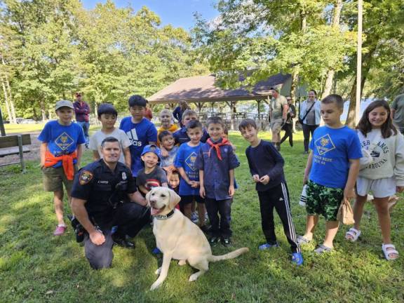 On September 8, Goshen Village Police Officer Jeremy Harter and K-9 Walker, conducted a K-9 demonstration for Boy Scout Pack 44.