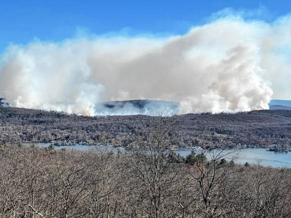 WMF4 Smoke rises from wildfires on the eastern side of Greenwood Lake.