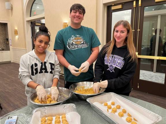 At Chabad’s CTeen program, Skylar Shaw, Ziva Lerman and Justin Reich of Monroe made over 100 matza balls for the Jennings Creek Wildfire first responders.