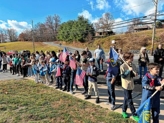 The Chester Girl Scouts joined the local Boys Scouts and other community members on Monday in honor of Veterans Day.