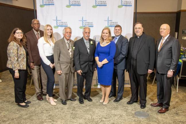 (L-R) Catholic Charities CEO Shannon Kelly; Dr. Walter Woodley, Kaitlyn Corrigan, Edward Anderman, Gary Anderman, Elizabeth Rowley, Community Foundation board chair Richard Shapiro, Esq., Fr. Greg Fluet; and Thomas Strahle, Catholic Charities board chair.