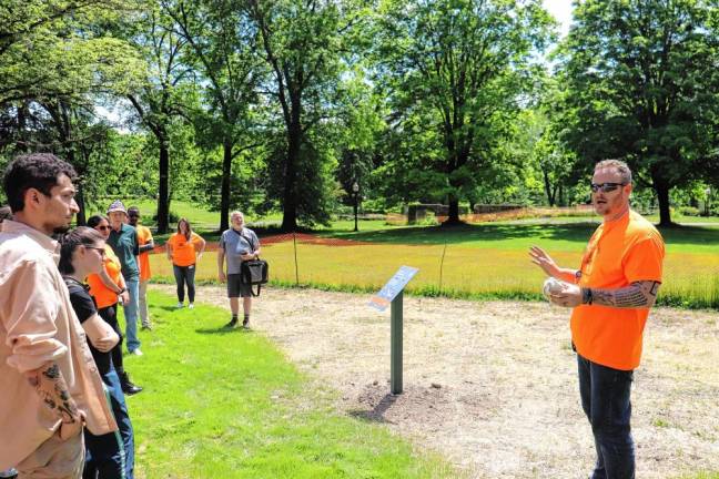 O&amp;R senior ecologist Casey Tompkins (far right) provides a tour of the new O&amp;R-funded Biodiversity Enhancement Area at the Goshen Public Library.