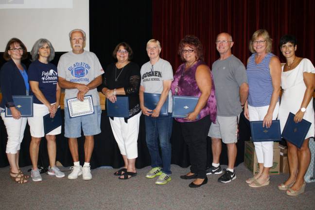 Faculty and staff members who have completed 20 years with the district (from left): Heidi Lawrence, Donna Guarneiri, Alan Benson, Judy McCarthy, Ellen Dickinson, Donna Meaney, Robert McIntee, Louise Giardina, and Margaret Goetze. (Not pictured: Wendy Wee)