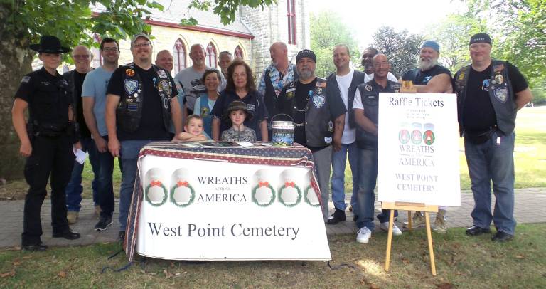 In the center of the photo, taken in Goshen, N.Y., is Jackie McNally, a volunteer at the West Point Cemetery. (Photo by Frances Ruth Harris)