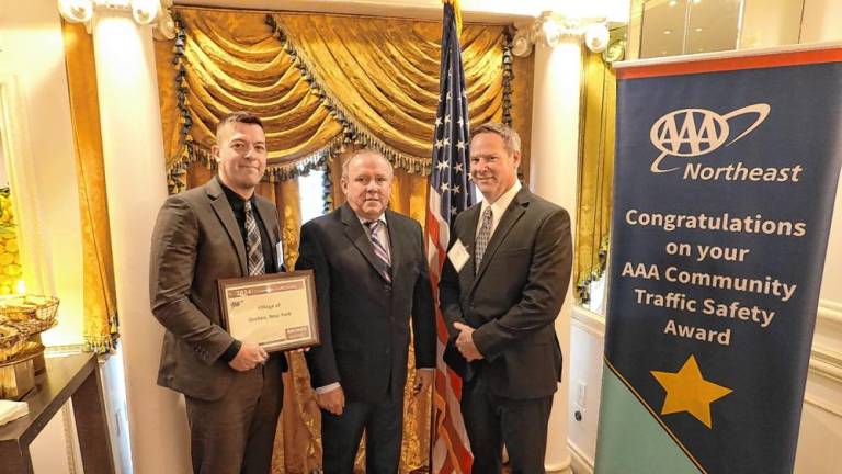 On Oct. 8, Goshen Village Police Sgt. David Yates and Det. Michael Feo accept a Bronze Award from the AAA Community Traffic Safety Awards Program for participating in projects such as pedestrian, motorcycle, bicycle, and child passenger safety initiatives.